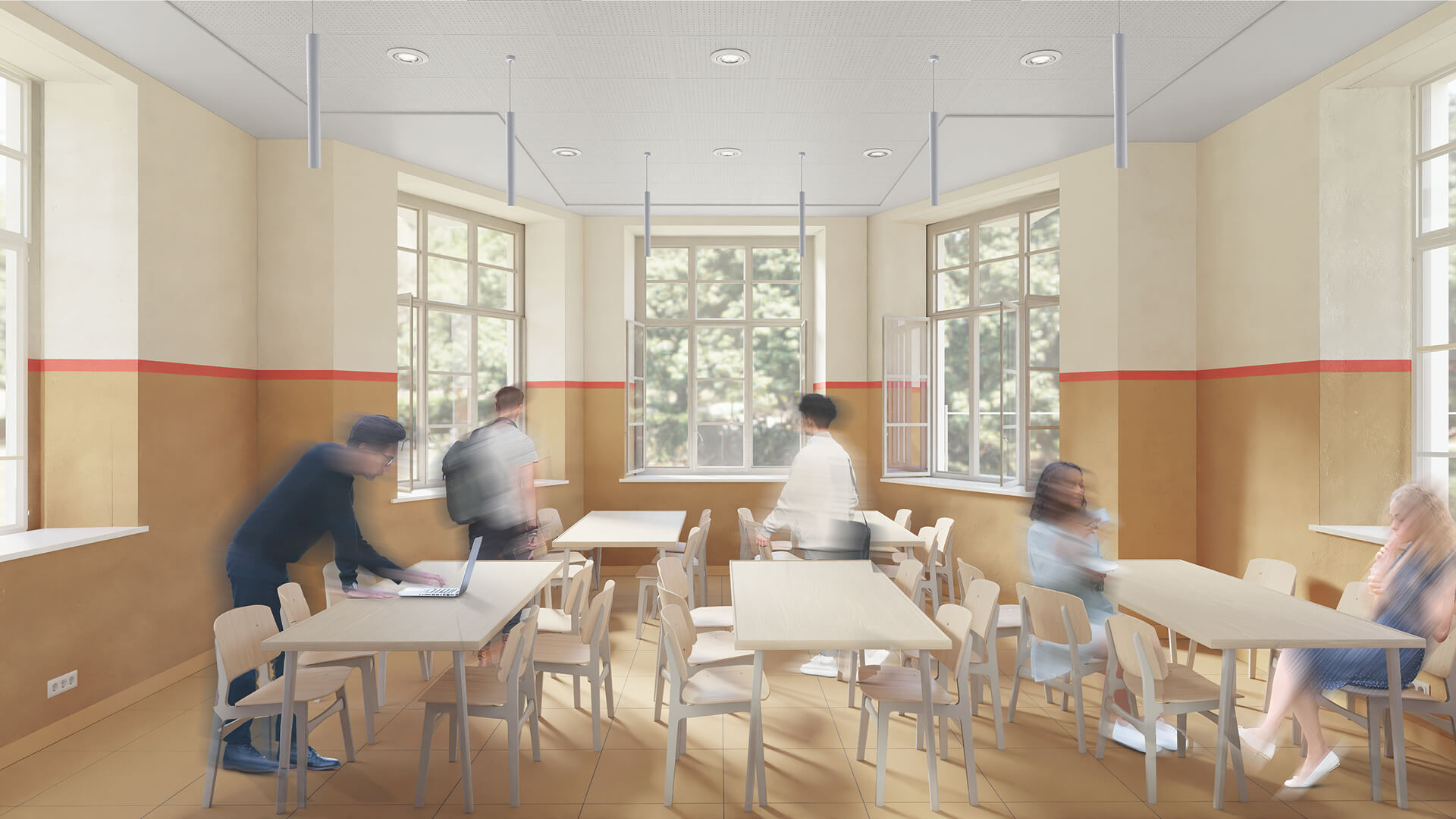 L'immagine rappresenta un ambiente luminoso, probabilmente una sala comune o una zona ricreativa di una scuola o di una residenza. Il design dell'interno è caratterizzato da pareti con due tonalità: una parte inferiore color terracotta e una superiore di un beige chiaro, interrotte da una linea rossa che corre lungo tutto il perimetro, dando un tocco di vivacità all'ambiente. Il pavimento è in piastrelle beige, mentre il soffitto è dotato di luci a soffitto moderne. La stanza è arredata con tavoli di legno chiaro e sedie abbinate, in stile semplice ma elegante. Le finestre grandi permettono alla luce naturale di entrare, creando un'atmosfera accogliente e ventilata, con diverse finestre aperte che consentono la circolazione dell'aria. Diverse persone sono visibili, in movimento, mentre interagiscono con l'ambiente: un giovane lavora su un computer portatile, altri sono in movimento e si spostano per la stanza. La scena, piena di vita e di energia, suggerisce un ambiente funzionale, perfetto per attività di gruppo, studio o relax, con una piacevole connessione visiva con l'esterno, grazie alla vista sul giardino o sul cortile circostante.