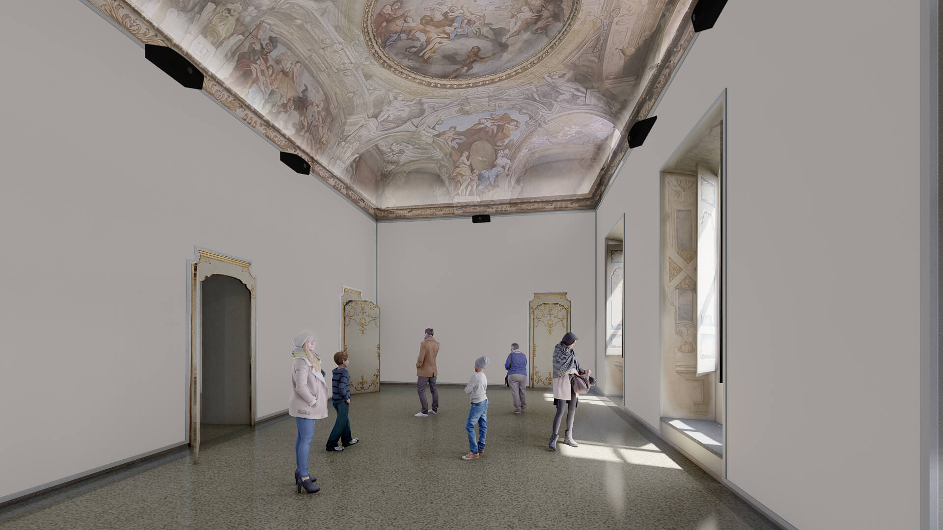 Sala storica restaurata con soffitto interamente affrescato e decorazioni pittoriche di gusto barocco, caratterizzata da pareti neutre lasciate libere per uso espositivo e da aperture con cornici decorate che conservano gli elementi ornamentali originali. L’ambiente è allestito come spazio museale, con illuminazione tecnica puntuale installata lungo il perimetro superiore per valorizzare il ciclo pittorico della volta, mentre il pavimento continuo e le superfici essenziali evidenziano l’intervento contemporaneo di riqualificazione. La presenza di visitatori all’interno della sala suggerisce la nuova destinazione pubblica dello spazio, in dialogo tra architettura storica restaurata e funzioni espositive.