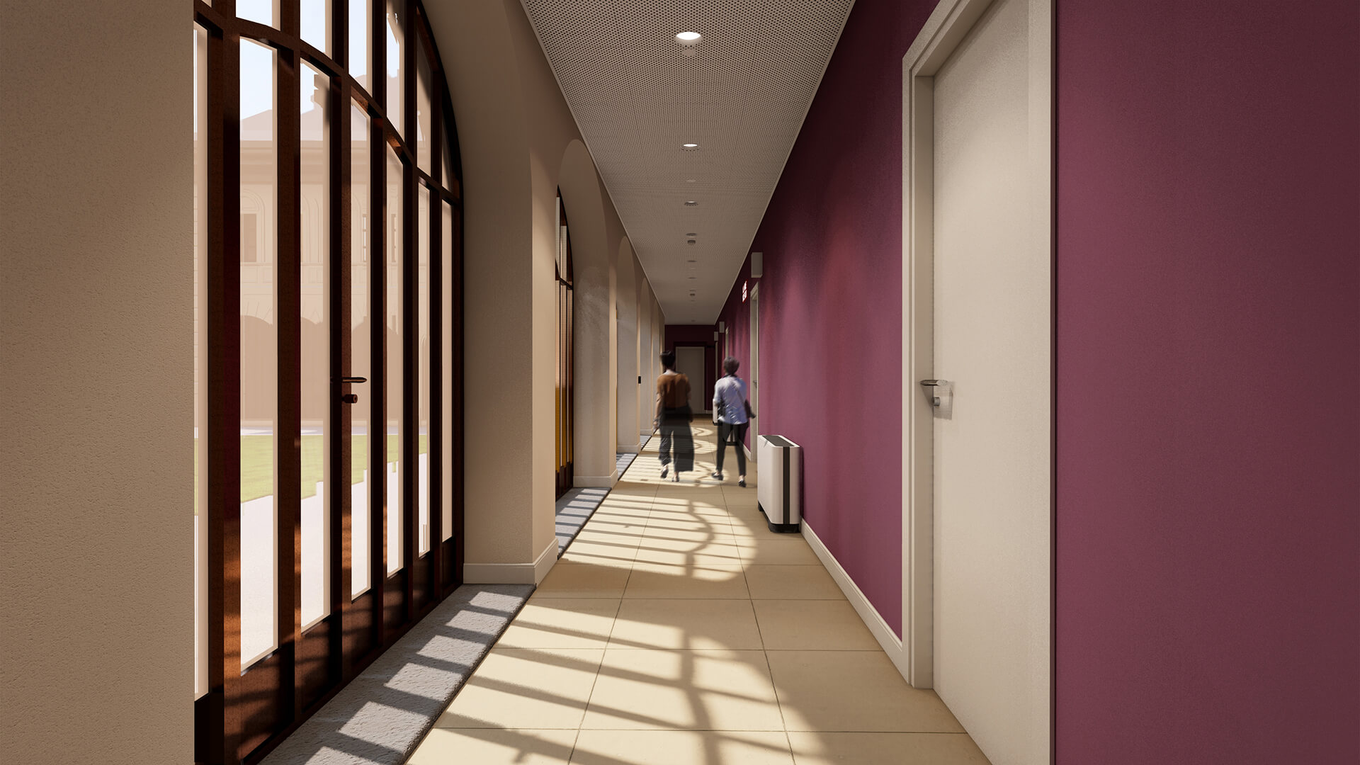 L'immagine mostra un ampio corridoio moderno che si distingue per un'atmosfera elegante e accogliente. Ecco una descrizione dettagliata: Dettagli principali: Struttura e materiali: Il corridoio è caratterizzato da pareti dai colori caldi, in particolare una tonalità di viola sulla destra, che dona un aspetto vivace e moderno. Il soffitto è piatto e presenta faretti a incasso, che forniscono una luce uniforme e diffusa. Le porte, ben rifinite e di colore chiaro, creano un contrasto con le pareti scure. Finestra e luce naturale: Una grande finestra ad arco su un lato del corridoio permette l'ingresso di abbondante luce naturale, illuminando bene l'ambiente e proiettando ombre suggestive sul pavimento. La luce solare che filtra attraverso la finestra crea un'atmosfera calda e accogliente. Arredamento e funzionalità: Il pavimento è rivestito con piastrelle beige che completano il design moderno del corridoio, mantenendo l'area luminosa e facile da pulire. Un piccolo termoconvettore è visibile sul lato destro, il che suggerisce un sistema di riscaldamento nascosto e discreto. Persone: Due persone sono in movimento lungo il corridoio, una di loro porta una valigia, indicando che questo potrebbe essere un ambiente come un hotel o un ospedale. La presenza delle persone contribuisce a far sembrare l'ambiente più vivo e funzionale. Atmosfera: Il corridoio ha un'aria moderna e luminosa, con un buon equilibrio tra il design architettonico tradizionale (finestre e porte classiche) e l'uso di colori audaci come il viola. L'atmosfera è invitante grazie alla luce naturale e ai dettagli di design contemporanei.